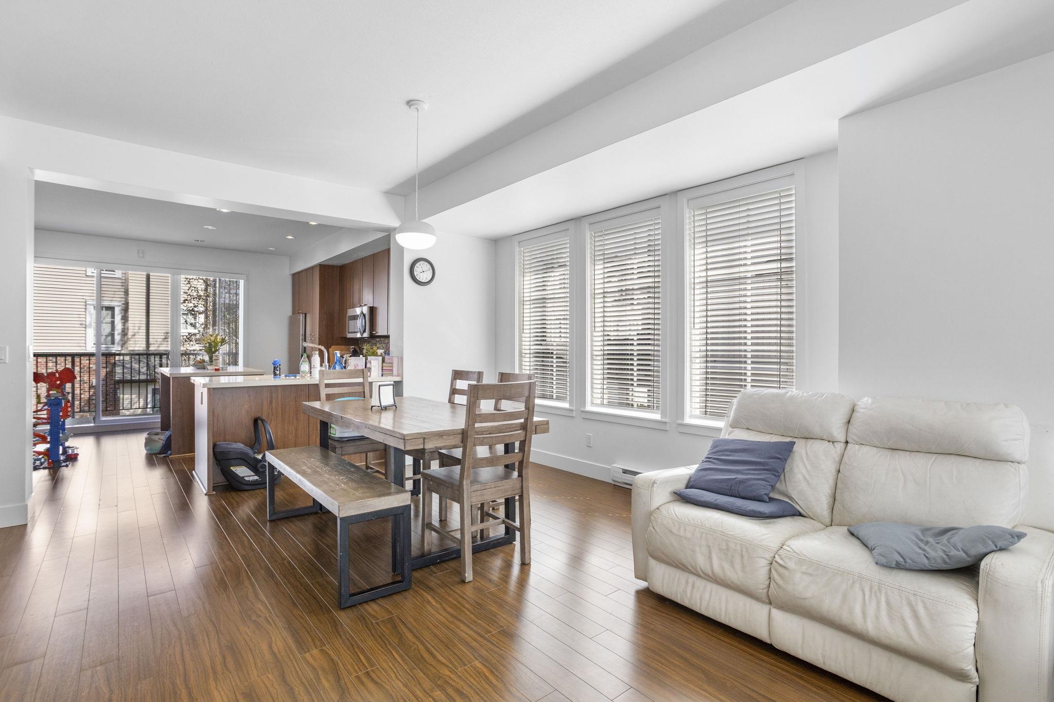 Open concept living and dining area with natural light South Surrey townhouse